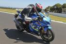 A blue 2017 Suzuki GSX-R1000R being ridden on a track