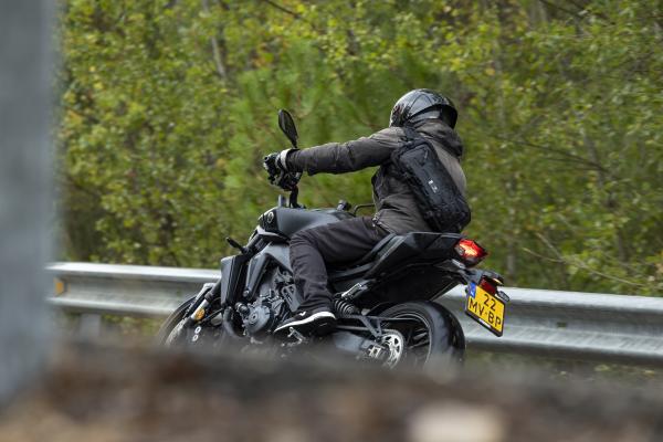 A Yamaha MT-09 Y-AMT being ridden in the rain