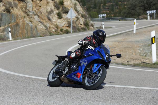 A motorcycle being ridden on a mountain road