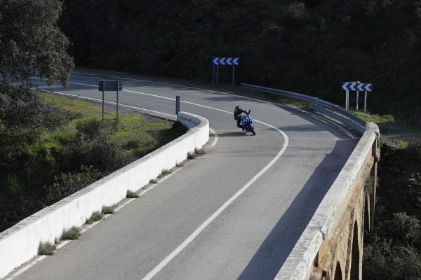 A motorcycle being ridden on a mountain road