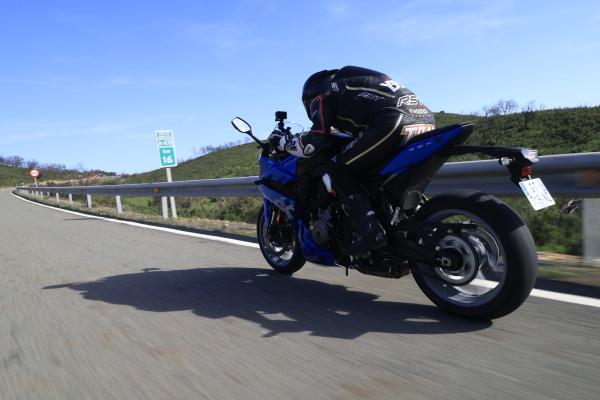 A motorcycle being ridden on a mountain road