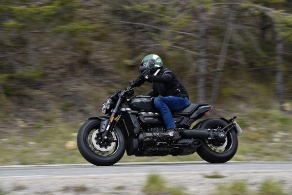 A motorcycle being ridden along a road