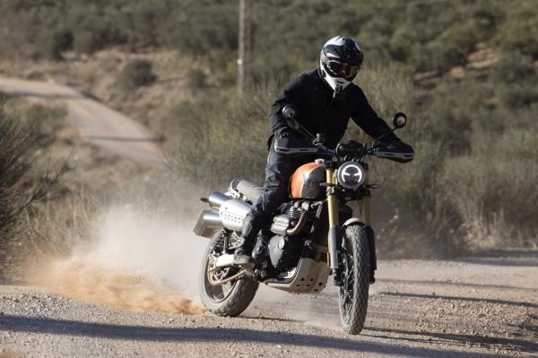 Power-sliding a motorcycle on a dirt track