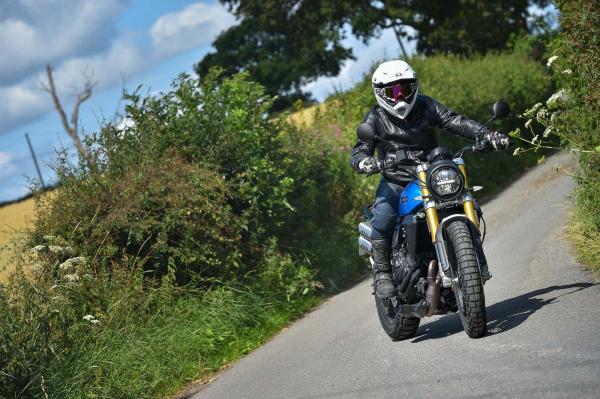 A motorcycle braking hard into a corner