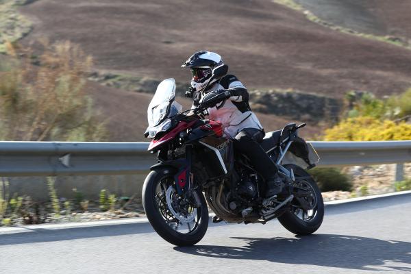 A motorcycle being ridden along a mountain road