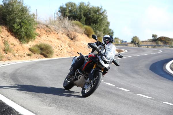 A motorcycle being ridden along a mountain road