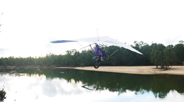 The bike and hang glider take flight